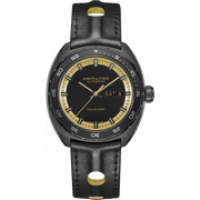 The Hamilton American Classic Pan Europ Day Date Automatic Men's Watch - 42mm features a black round dial with gold hour markers and hands. The dial is inscribed with "HAMILTON AUTOMATIC" and includes a day and date display at the 3 o'clock position. Inspired by retro aesthetics, this wristwatch comes with a black leather strap adorned with gold accents.