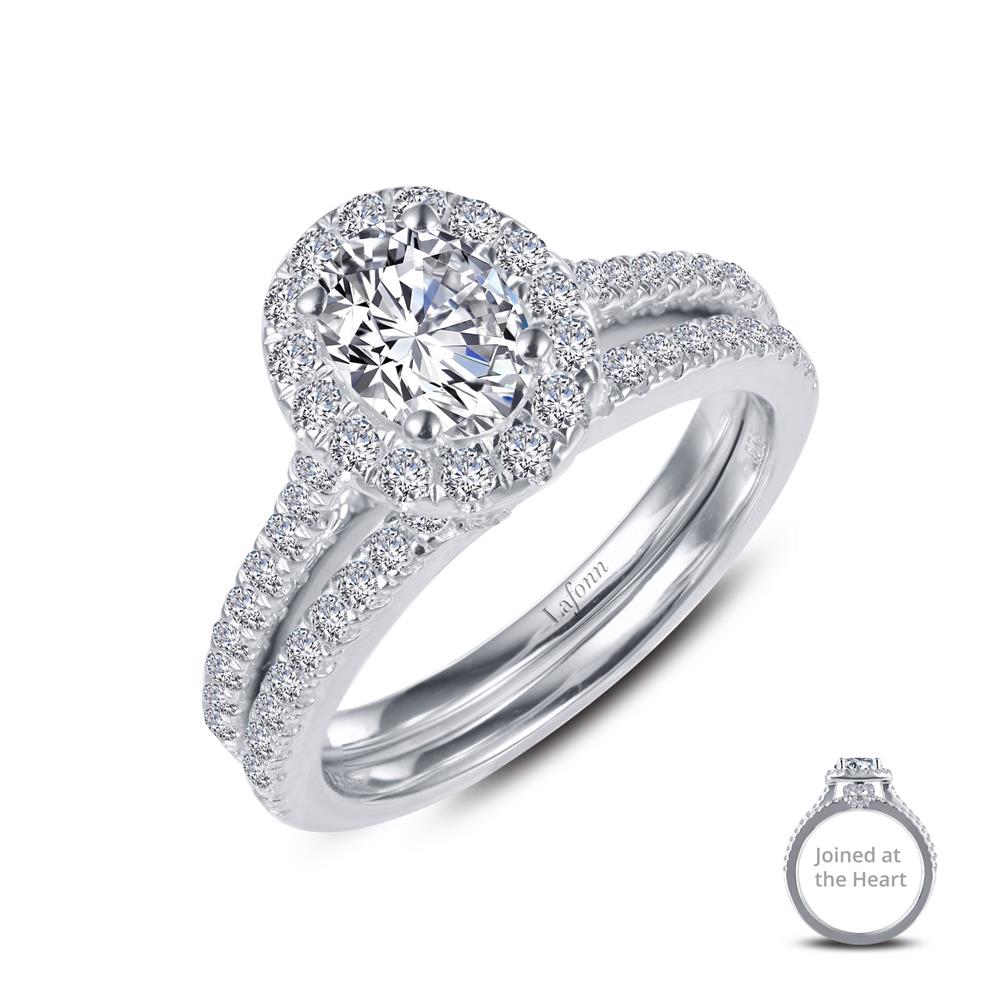 A close-up of the Joined-At-The-Heart Wedding Ring by Lafonn, featuring an engagement ring with a central round diamond surrounded by smaller diamonds, and a matching wedding band. Both rings showcase intricate diamond detailing. An inset shows the Joined-At-The-Heart rings together.