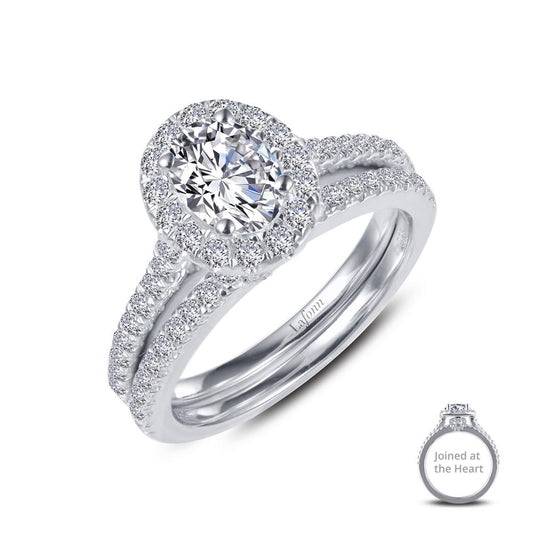 A close-up of the Joined-At-The-Heart Wedding Ring by Lafonn, featuring an engagement ring with a central round diamond surrounded by smaller diamonds, and a matching wedding band. Both rings showcase intricate diamond detailing. An inset shows the Joined-At-The-Heart rings together.