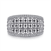 This Gabriel & Co Bujukan Collection piece, the 925 Sterling Silver White Sapphire Wide Bujukan Ring, features a luxurious design adorned with three rows of polished spherical beads. It's elegantly flanked by two rows of small, glittering diamonds on the top and bottom edges, with an added touch of white sapphires for extra sparkle.
