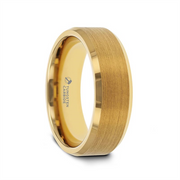 The Thorsten HONOR Gold-Plated Tungsten Beveled Polished Edges Flat Ring with Brush showcases a sleek and modern design. The brushed gold-plated tungsten ring features polished beveled edges, while the smooth inner band is engraved with "Tungsten Carbide." The brushed center subtly reflects light, adding to its contemporary elegance.