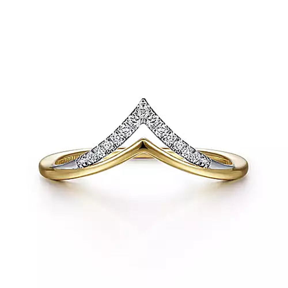 The Gabriel & Co 14K White-Yellow Gold Diamond Chevron Ring showcases a V-shaped design. The apex of the V is embellished with small, sparkling diamonds, providing a striking contrast against the 14K white-yellow gold band. The resulting look is sleek and elegant.