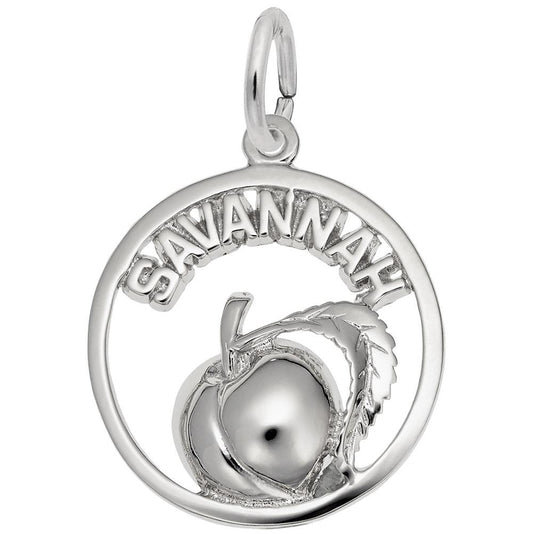 The Savannah Peach Charm by Rembrandt Charms is a sterling silver pendant with the word "SAVANNAH" at the top, elegantly highlighting a raised peach with a leaf centered within its circular frame.