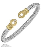 The Diamonds 4mm Bracelet by Alwand Vahan Jewelry is a sterling silver piece adorned with two ornate 14K yellow gold clasps, each accented with a refined diamond at its center. This design elegantly merges metallic textures to achieve a timeless and sophisticated aesthetic.