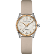 The Hamilton Mother of Pearl Automatic wristwatch features a white textured dial with gold hour markers and hands, encased in a silver and gold-tone PVD coated bezel. The brand name "Hamilton" is displayed below the 12 o'clock position. It also comes with a beige leather strap.