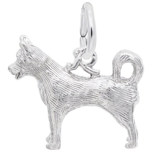 The Rembrandt Charms Husky Charm, crafted from sterling silver, showcases a detailed, textured design of a standing Husky with a curled tail and pointed ears. It includes a round loop at the top for easy attachment to a pendant or bracelet.