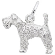 The Rembrandt Charms KERRY BLUE TERRIER/ Sterling Silver charm beautifully captures the essence of a Kerry Blue Terrier standing with its tail raised, featuring intricately detailed textured fur and an attached circular loop at the top for easy hanging or attachment to a bracelet or necklace.