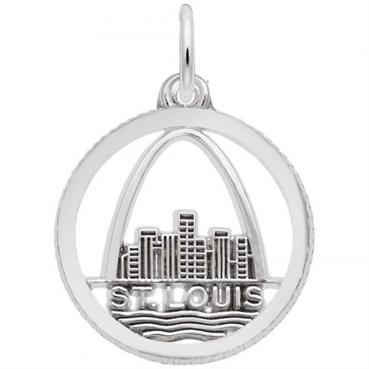 The St. Louis Skyline Disc Charm by Rembrandt Charms is a sterling silver pendant designed as a circular charm, showcasing a cutout of the St. Louis skyline with the Gateway Arch prominently featured in the background. "ST. LOUIS" is engraved at the bottom along with wavy lines symbolizing water, and it includes a small loop at the top for attaching to a chain.