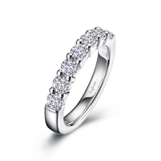 A sleek Half-Eternity Band by Lafonn, crafted from white gold and adorned with a row of round-cut diamonds encircling the top half. The inner band features an engraving of "Lafonn." This exquisite ring catches the light, highlighting the brilliance and clarity of its diamonds.