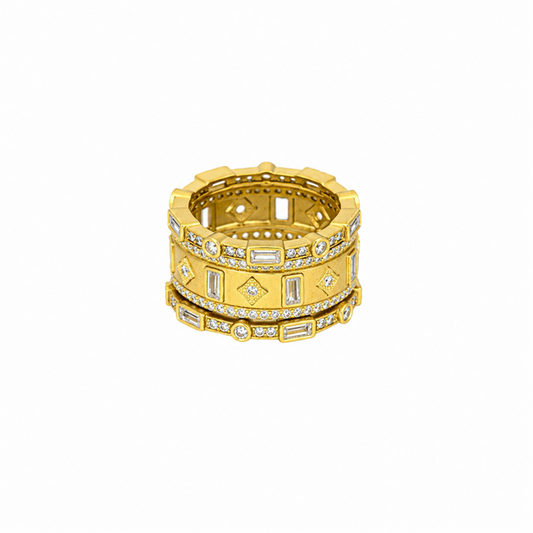 The Freida Rothman PYZR090242B Celestial Window 3 Stack Ring in gold tone, size 7, features geometric patterns and rows of white gemstones, displayed on a plain white background.