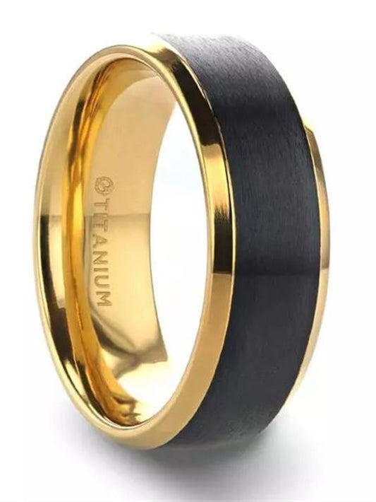 The "Polished Gold Plated Titanium Ring with Beveled Edges and Brushed Black Center in 8mm" by Thorsten features a sophisticated design, including a gold-plated titanium exterior with beveled edges and a brushed black matte center. The inner surface is adorned with gold and engraved with 'TITANIUM', while the outer surface boasts an elegant gold border that perfectly complements the matte center band.