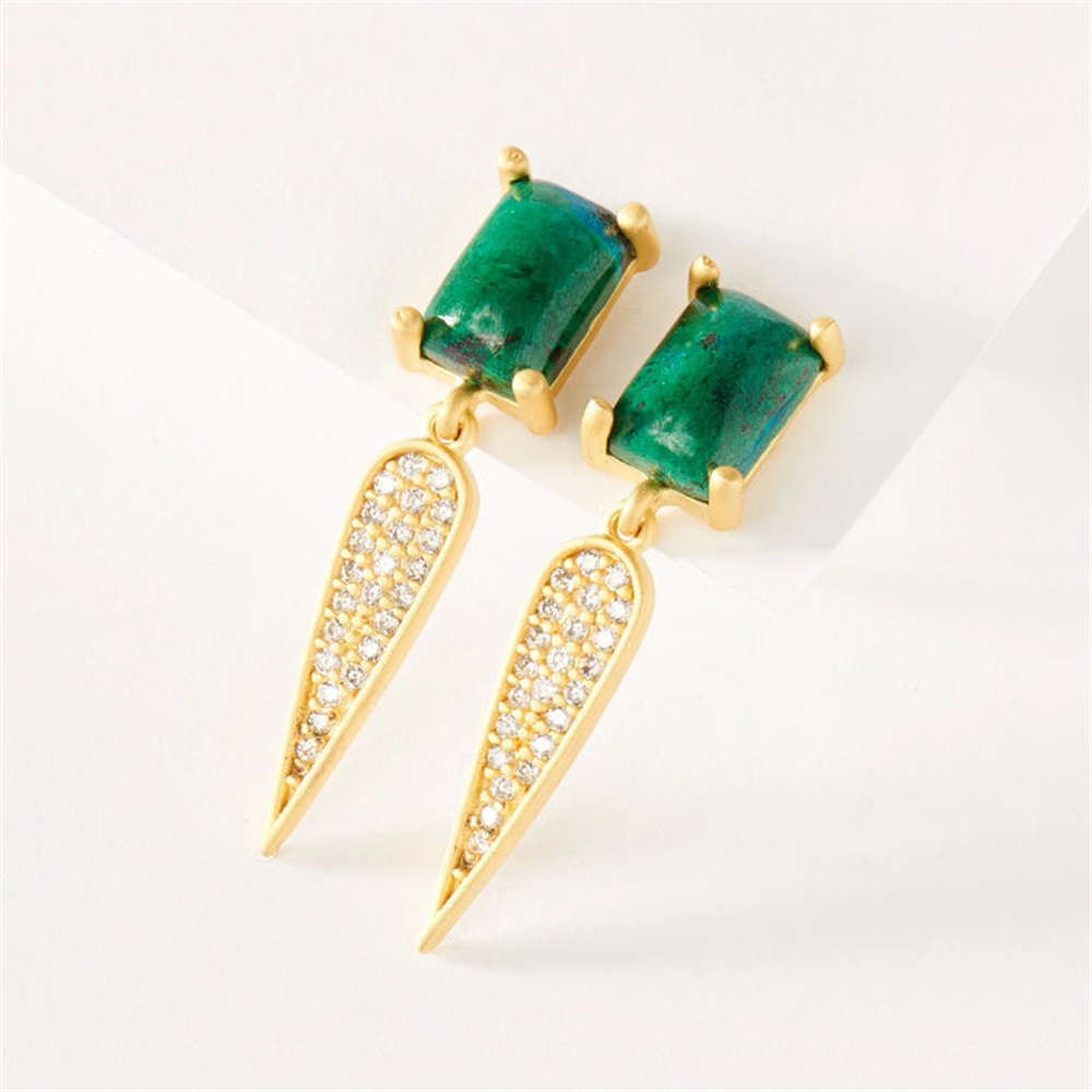 The Freida Rothman HAYZCE08 Harmony Chrysocolla and Pave Dagger drop earrings feature rectangular green stones atop gold drops with teardrop-shaped dangles encrusted with clear crystals, displayed on a white surface.
