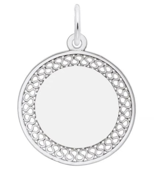 The Medium Filigree Disc Charm by Rembrandt Charms features a round sterling silver pendant with a plain circular center, surrounded by an intricately designed medium filigree disc pattern. It includes a small loop at the top for easy attachment to a chain or necklace. The openwork design comprises repeating curvilinear shapes, making it an ideal charm.