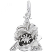 The Magnolia Flower Charm from Rembrandt Charms is beautifully shaped like a bloom, featuring a loop at the top for attaching to a chain. The sterling silver petals are spread open, revealing a delicately crafted center, while small leaves extend from the base of this exquisite charm.