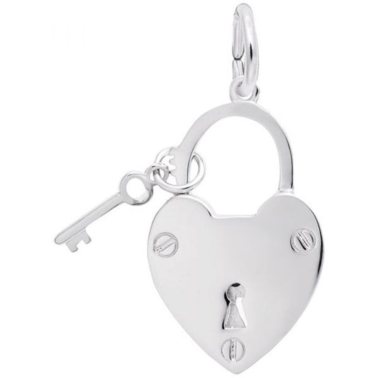 The "Locked With Love Charm / Sterl" by Rembrandt Charms is a sterling silver, heart-shaped padlock accompanied by a matching key, connected by a small ring at the top. The padlock features a keyhole in the center and two screws near the bottom, showcasing a design that is both simple and elegant.