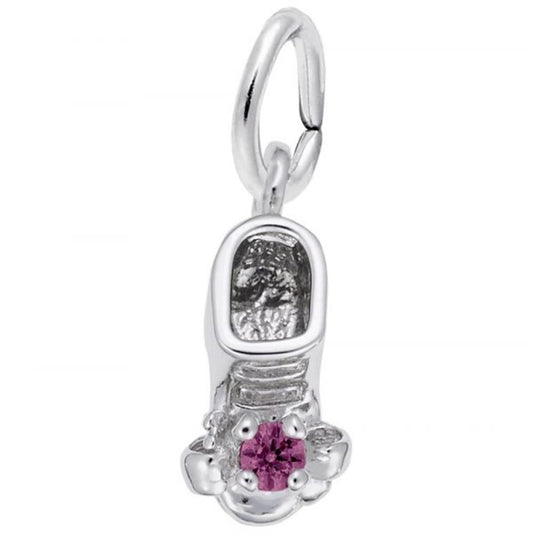 The Rembrandt Charms July Baby Bootie Charm is a sterling silver piece in the shape of a baby shoe, featuring an intricate design with laces and stitching. It boasts a pink gemstone accent on the toe and comes with a loop for easy attachment to bracelets or necklaces.