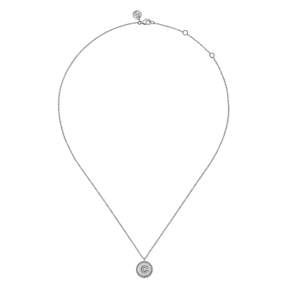 The Gabriel & Co 925 Sterling Silver Diamond Bujukan Initial C Necklace is a delicate piece featuring a circular pendant with a double "C" logo at its center, surrounded by a ring of small, sparkling crystals. Part of the Bujukan Collection, the chain boasts an elegant and simple design with an adjustable clasp.