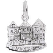 This sterling silver charm from Rembrandt Charms, named "Victorian House, San Francisco Charm," depicts three Victorian-style houses known as "Painted Ladies" with the words "San Francisco" inscribed below them. It features a small loop at the top for attaching to a bracelet or necklace.