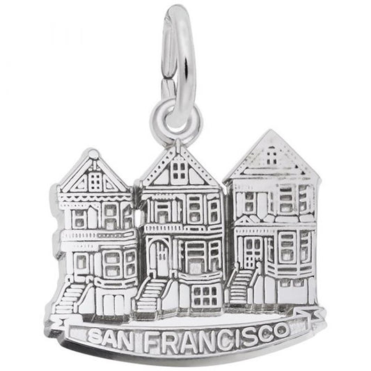 This sterling silver charm from Rembrandt Charms, named "Victorian House, San Francisco Charm," depicts three Victorian-style houses known as "Painted Ladies" with the words "San Francisco" inscribed below them. It features a small loop at the top for attaching to a bracelet or necklace.