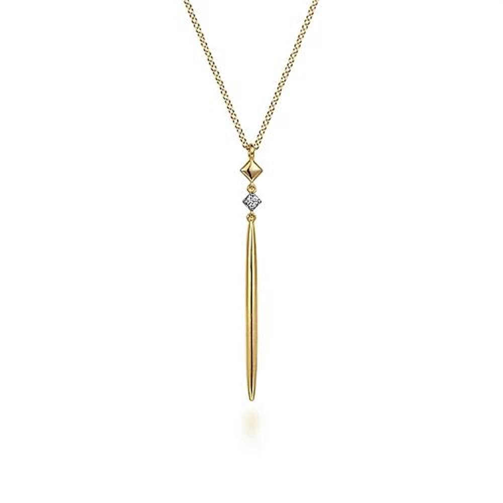 The 14K Yellow Gold Diamond Pendant Drop Necklace by Gabriel & Co features a long, slender diamond pendant in 14K yellow gold, accented with a small geometric gold shape above it. The pendant gracefully hangs from a delicate gold chain, epitomizing an elegant and minimalist modern design aesthetic.