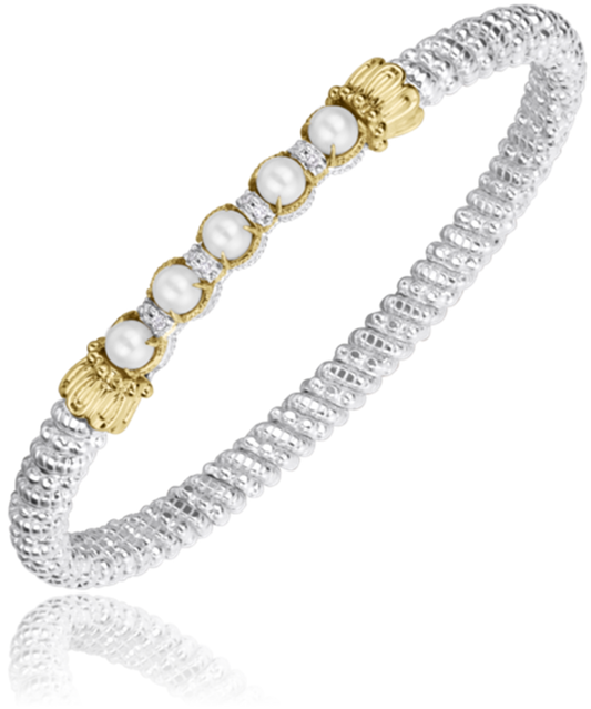 Alwand Vahan Jewelry's 4MM PEARL silver bracelet showcases a textured band adorned with pearl beads, each measuring 4mm. The pearls are separated by small diamond-like stones, and the row is elegantly capped with gold decorative accents.