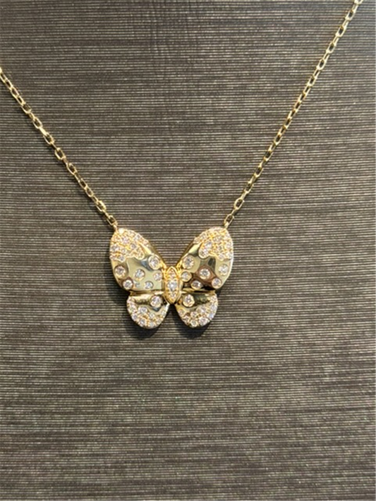 The Ryan Gems Diamond Butterfly Necklace in 14k yellow gold features a butterfly-shaped pendant with sparkling stones, shown against a textured dark background.