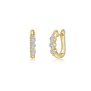 A pair of elegant gold hoop earrings, reminiscent of Lafonn's GP 3 stone huggies, adorned with three evenly spaced round diamonds on each earring. The diamonds are set vertically along the outer edge, adding a touch of sparkle to the polished gold hoops. The earrings have a secure hinge closure.