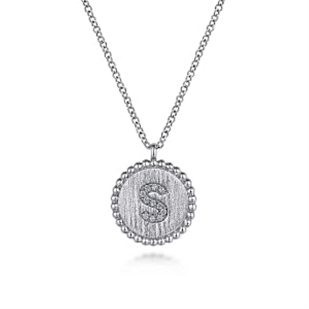 The 925 Sterling Silver Diamond Bujukan Initial S Necklace by Gabriel & Co features a circular pendant encrusted with small diamonds, with a diamond-adorned letter "S" in the center. This elegant piece from the Bujukan Collection is crafted in 925 sterling silver and comes with a simple, yet sophisticated chain design. Serial No: S.
