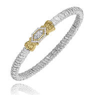 Introducing the Alwand Vahan Jewelry 4MM Closed Band (Size B4 / 23588D04), a stunning silver bracelet that showcases a textured design. This elegant piece is highlighted by a central hexagonal element adorned with small diamonds totaling 0.20 carats, beautifully framed by exquisite gold accents. The intricate craftsmanship and luxurious materials give this bracelet an air of sophistication and charm.