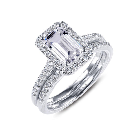 Introducing the Emerald-Cut Halo Wedding Set Size 7 by Lafonn: this exquisite set features a captivating emerald-cut center stone encircled by a halo of dazzling diamonds. The set is complemented by a matching silver wedding band, elegantly adorned with small diamonds for an added touch of sophistication and sparkle.