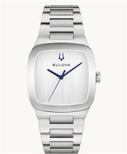 The Bulova 96A336 Millennia Latin Grammy men's watch features a silver-tone case, blue dial, brushed metal face, blue hands, minimalist design without hour markers, and a matching silver band—striking and iconic.