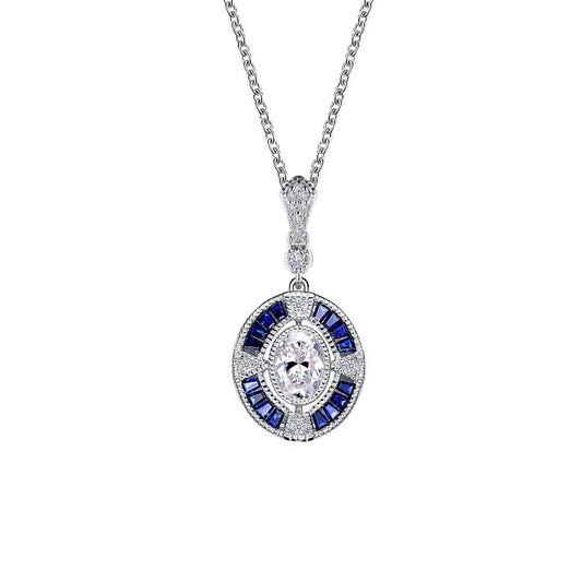 The Art Deco Inspired Pendant Necklace by Lafonn features a detailed silver chain showcasing an Art Deco pendant. The pendant boasts a central oval-shaped white gemstone encircled by smaller simulated diamonds and rectangular lab-grown sapphires arranged in an intricate pattern.
