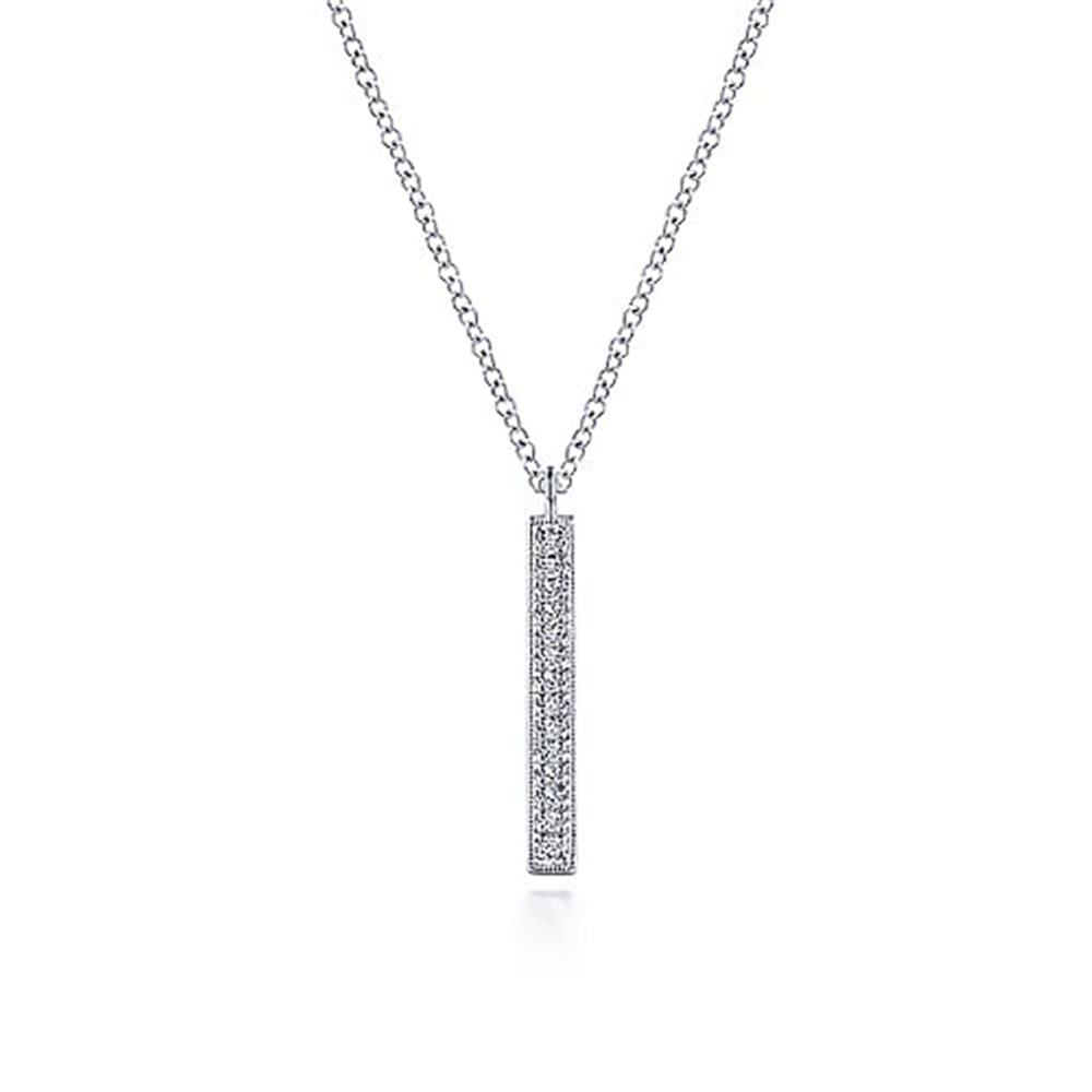 Introducing the Gabriel & Co 14K White Gold Diamond Bar Pendant Necklace, a timeless piece from our Lusso Collection. This exquisite necklace features a silver vertical bar adorned with small diamonds and is paired with a delicate chain that enhances its elegant simplicity. The minimalist design beautifully showcases the sparkling diamonds, making it a perfect addition to any jewelry collection.