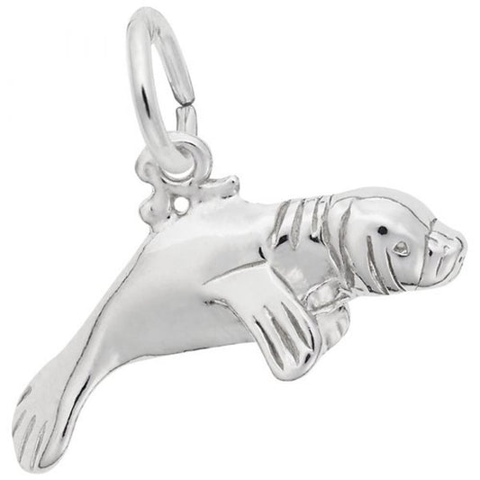 A sterling silver manatee charm with an attached loop for hanging, featuring detailed facial and flipper accents, showcasing the exquisite craftsmanship characteristic of Rembrandt Charms.