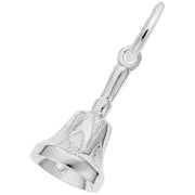 A Hand Bell Charm crafted from sterling silver by Rembrandt Charms, displaying intricate designs on its surface and attached to a loop for hanging. The charm includes a smooth handle and a delicately crafted clapper inside, showcased against a plain white background.