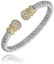 The Alwand Vahan Jewelry 6mm Band Bracelet, crafted from sterling silver and embellished with 14KT gold end caps featuring 0.09CT sparkling gemstones, boasts an intricate, textured design. The open-ended bracelet is adjustable to fit various wrist sizes.