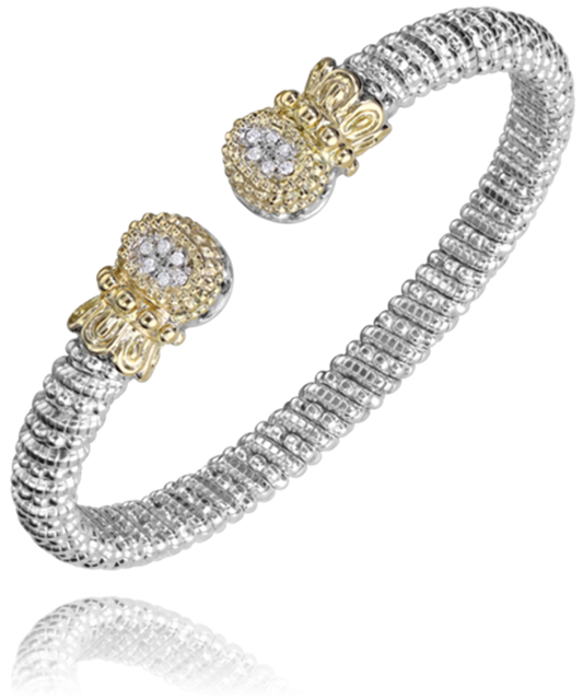 The Alwand Vahan Jewelry 6mm Band Bracelet, crafted from sterling silver and embellished with 14KT gold end caps featuring 0.09CT sparkling gemstones, boasts an intricate, textured design. The open-ended bracelet is adjustable to fit various wrist sizes.