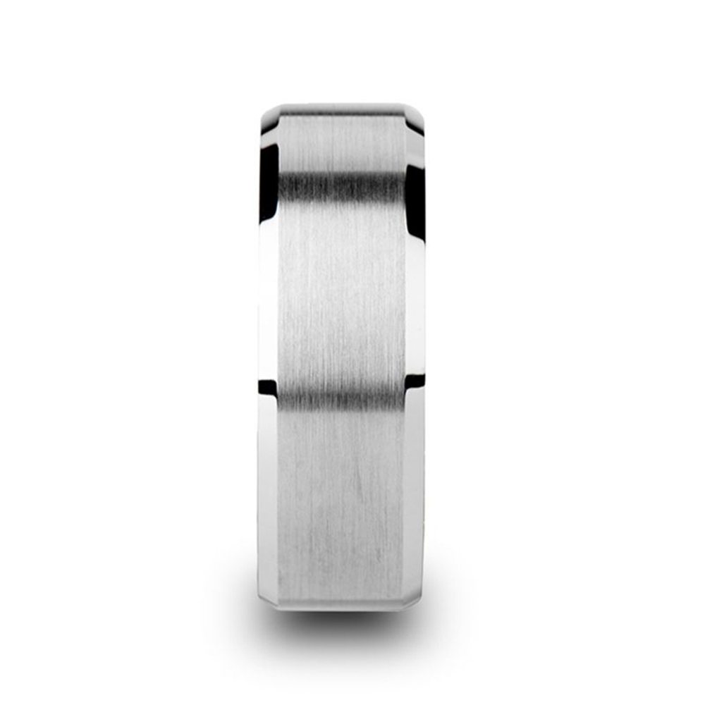 A silver, brushed finish metal ring with a flat profile and sleek, polished edges. This 6mm SHEFFIELD Flat Beveled Edges Tungsten Ring by Thorsten features a modern and minimalistic design. The ring is upright, displaying its width and texture perfectly.