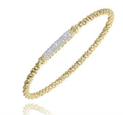 The Alwand Vahan Jewelry Diamonds and Gold Bracelet by Vahan is a delicate 14K Yellow Gold bracelet showcasing a beaded design with a central section adorned with small, sparkling diamonds. Its refined and elegant appearance makes it an ideal choice for formal and special occasions.