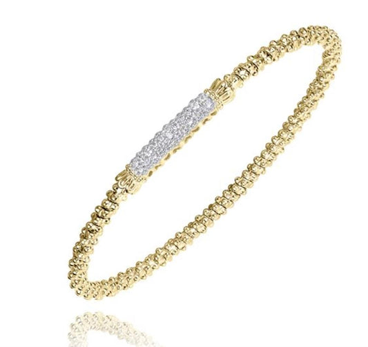 The Alwand Vahan Jewelry Diamonds and Gold Bracelet by Vahan is a delicate 14K Yellow Gold bracelet showcasing a beaded design with a central section adorned with small, sparkling diamonds. Its refined and elegant appearance makes it an ideal choice for formal and special occasions.