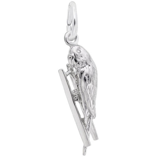 A stunning piece from Rembrandt Charms, the Budgie Bird Charm in sterling silver features an intricately detailed budgie with textured feathers, perched gracefully on a thin, rectangular bar. This charm includes a small loop at the top for easily attaching it to your favorite necklace or bracelet.