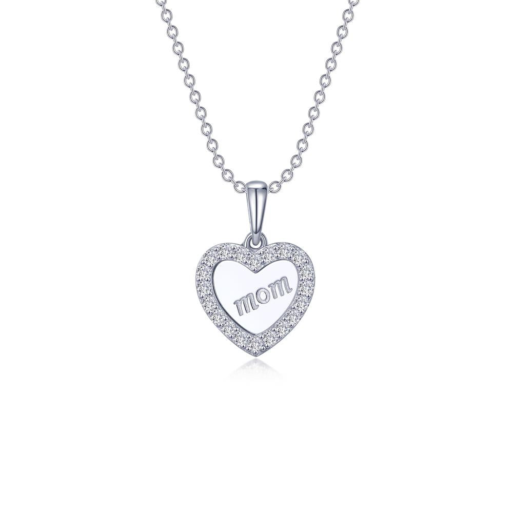 The Mom Heart Necklace by Lafonn is a sterling silver piece featuring a heart-shaped pendant engraved with the word "mom" in the center. The pendant is adorned with small, simulated diamonds around the border and hangs from a delicate chain, making this timeless classic truly special.