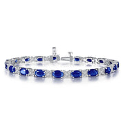 A Lafonn Classic Alternating Bracelet adorned with alternating blue gemstones and clear crystals. This sterling silver piece from Lafonn is finely detailed, with each blue gemstone set in an oval shape, surrounded by the sparkling clear crystals, creating an elegant and luxurious design.