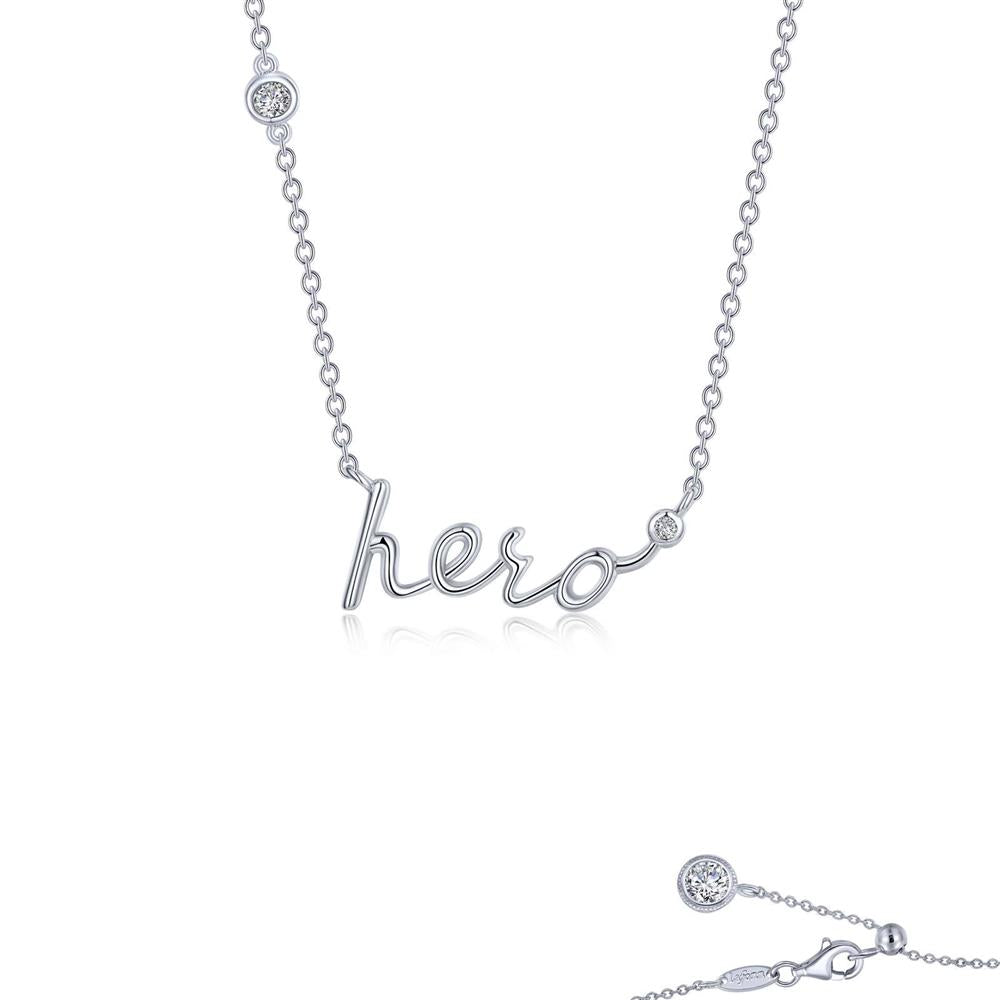 The Hero Word Necklace by Lafonn is a silver piece decorated with the word "hero" in a cursive style pendant. It is accented with small, circular diamond studs on either side of the word, one on the chain and one near the clasp. The background is plain white.