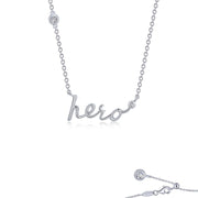 The Hero Word Necklace by Lafonn is a silver piece decorated with the word "hero" in a cursive style pendant. It is accented with small, circular diamond studs on either side of the word, one on the chain and one near the clasp. The background is plain white.