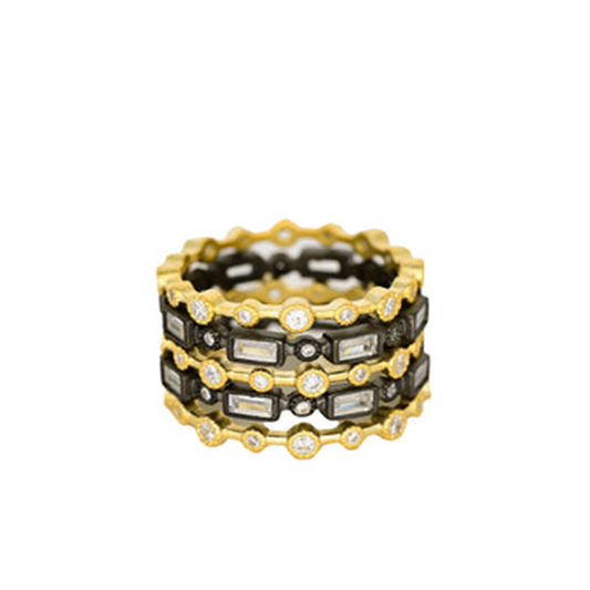 The Freida Rothman YRZR090243B Celestial Geometric 5 Stack ring features black and gold accents with clear gemstones in a celestial style. Displayed on a white background. Available in size 7.