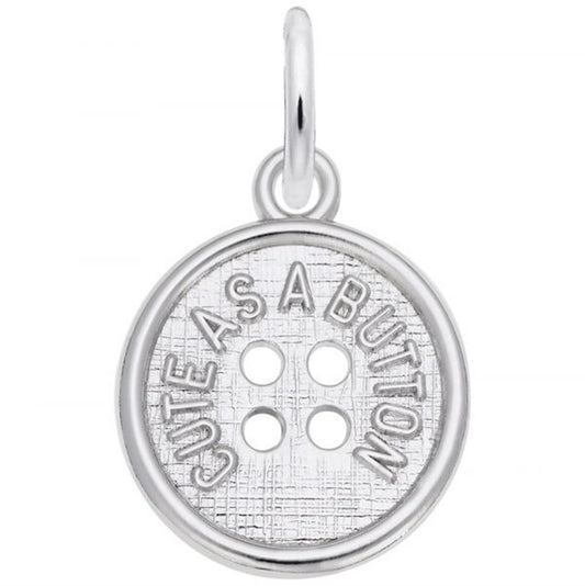 The Cute As A Button Charm by Rembrandt Charms is crafted from sterling silver and resembles a button with four small holes in the center. It features the engraved phrase "CUTE AS A BUTTON" around its edge and includes a loop at the top for easy attachment to a necklace or bracelet.