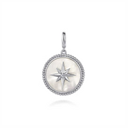 The Gabriel & Co 925 Sterling Silver Bujukan White Sapphire and Mother Of Pearl Round pendant features a central compass rose design with eight-pointed star details. The round silver pendant is fashioned from 925 Sterling Silver, adorned with small beaded accents around the edge and includes a small hoop at the top for easy attachment to a chain. The background is white.