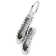 The image shows the Sterling Silver Small Ballet Slippers Charm from Rembrandt Charms. The charm is crafted in sterling silver and features a detailed design of a pair of ballet slippers. It measures 0.31 inches by 0.71 inches (8 mm x 18 mm) and has the style number 8286. This charm is a perfect keepsake for dancers and ballet enthusiasts.