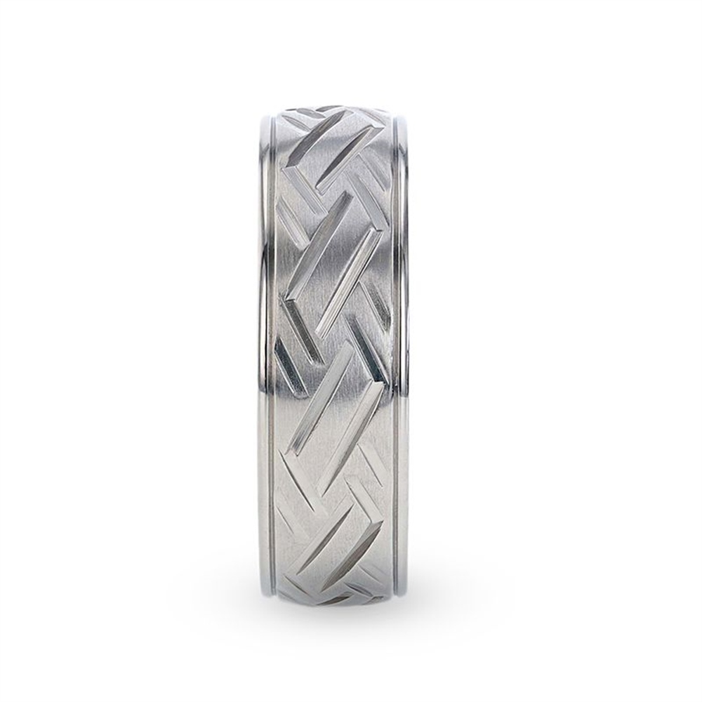 A silver SATURN Woven Pattern Titanium Ring by Thorsten, featuring an 8mm band with interwoven lines and a matte finish, etched with a Celtic-style woven pattern around the entire ring for a distinct and intricate appearance.